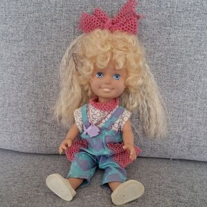 Vintage Doll with Pink Bow and Blue Overalls With Hair That Grows